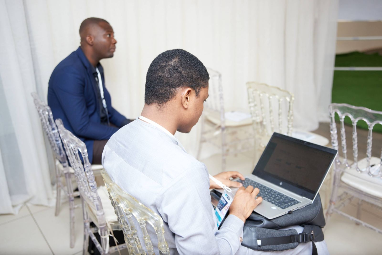 Two founders reviewing data on a laptop